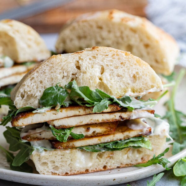 Tofu sandwich on a plate.