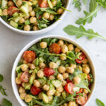 Chickpea avocado salad served in a small white bowl.