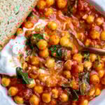 Braised chickpeas served with yogurt and toast.