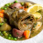 artichokes constantinople- steamed artichoke in a veggie stew with a lemon wedge