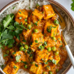 tofu tikka masala in a large bowl with fresh cilantro on top