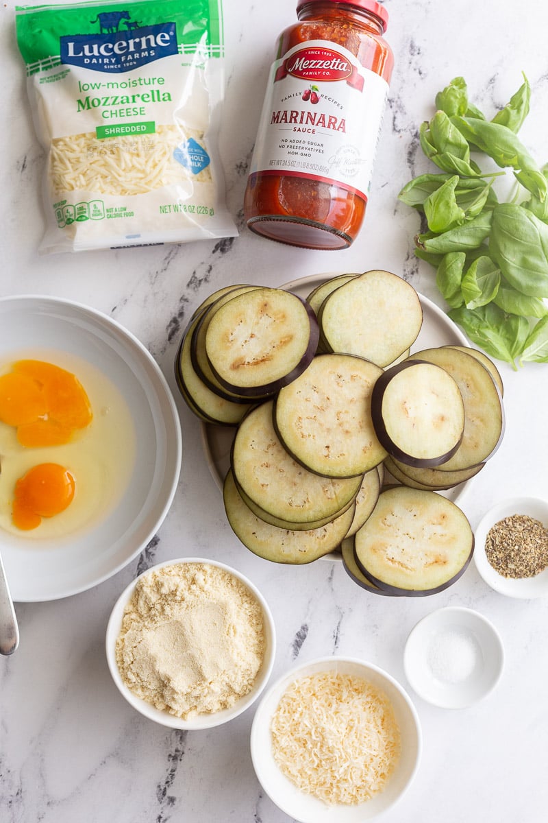 Uncooked ingredients to make eggplant recipe divided into portions.