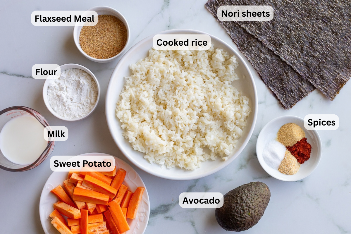 labeled ingredients to make sweet potato sushi including cooked rice, sweet potato, avocado, nori sheets, flour, and milk