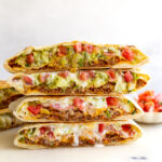 impossible meat crunchwrap supreme copycat from taco bell. 4 halves stacked on top of eachother