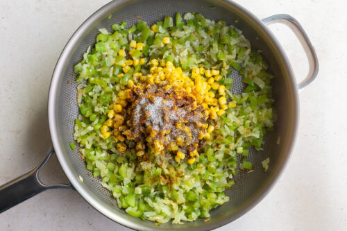 sauteed veggies in a skillet for enchiladas