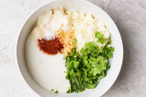ingredients for mexican street corn sauce in a bowl