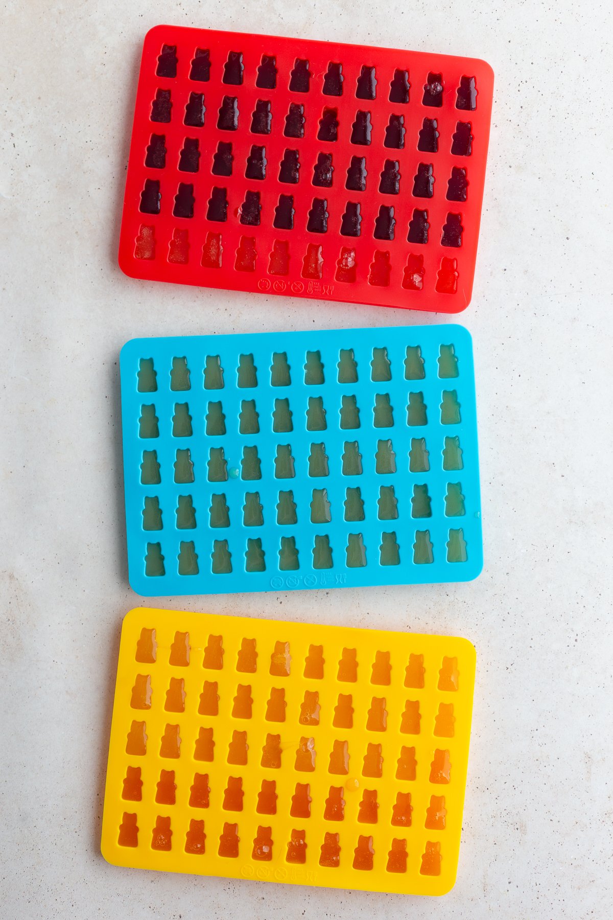 Gummy bear mixture in candy molds.
