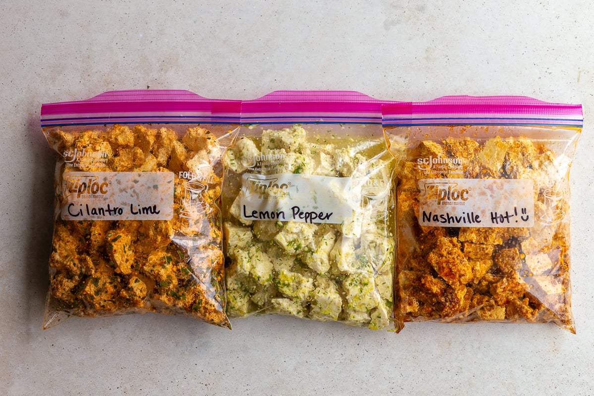3 tofu marinades lined up in plastic bags