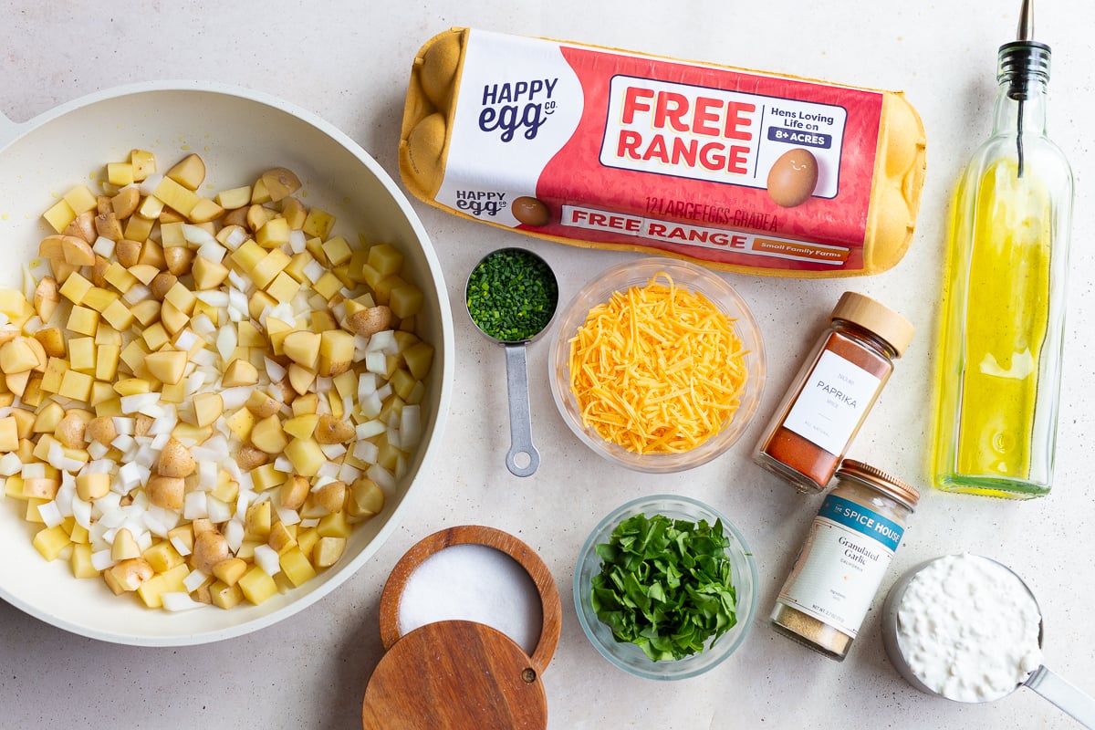 ingredients needed to make a Starbucks egg bites recipe including eggs, cheese, potatoes, and chives