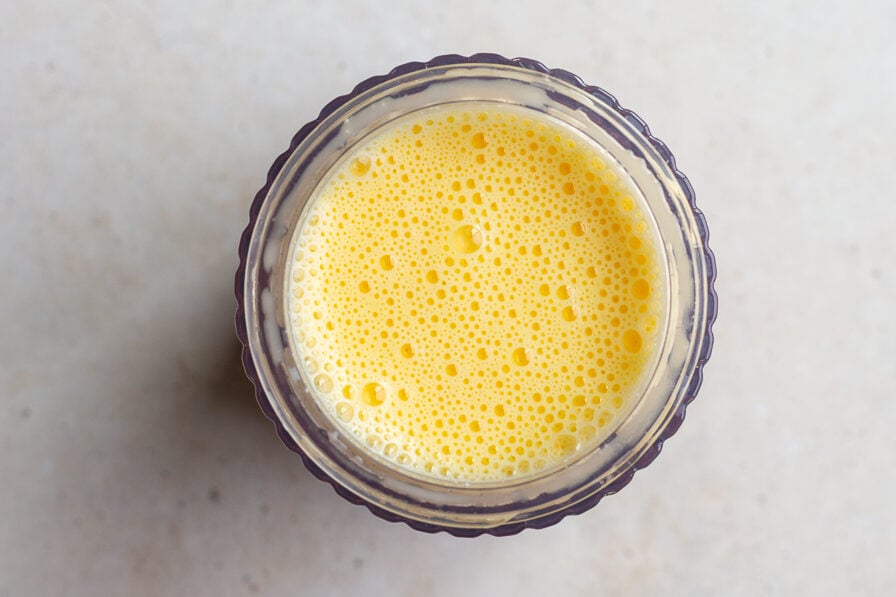 blended eggs and cottage cheese in a blender base