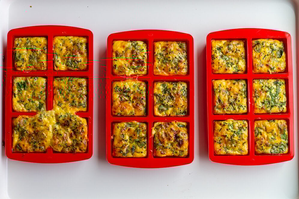 potato chive eggs bites in bright red silicone molds