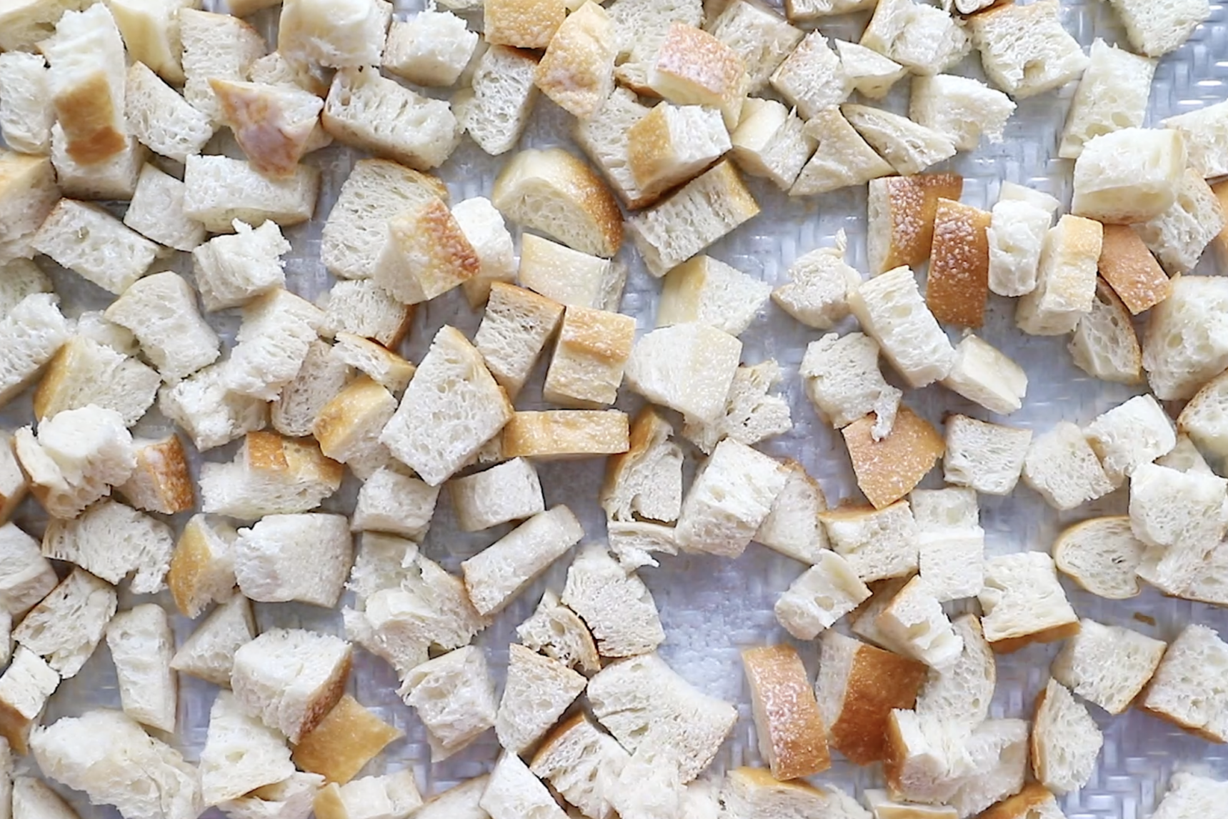 sourdough bread on a sheet pan to make vegan stuffing