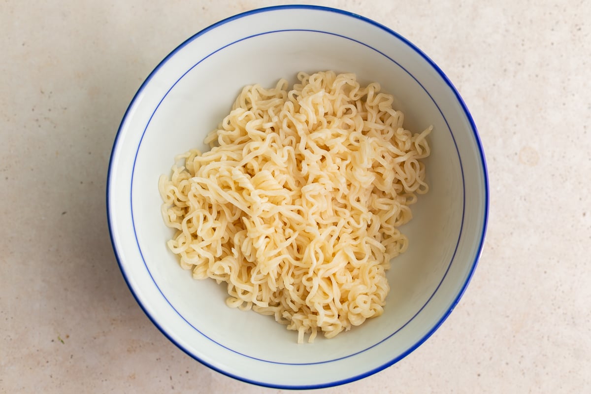 how to make homemade ramen: step 4 cook the ramen noodles and add them to a ramen bowl