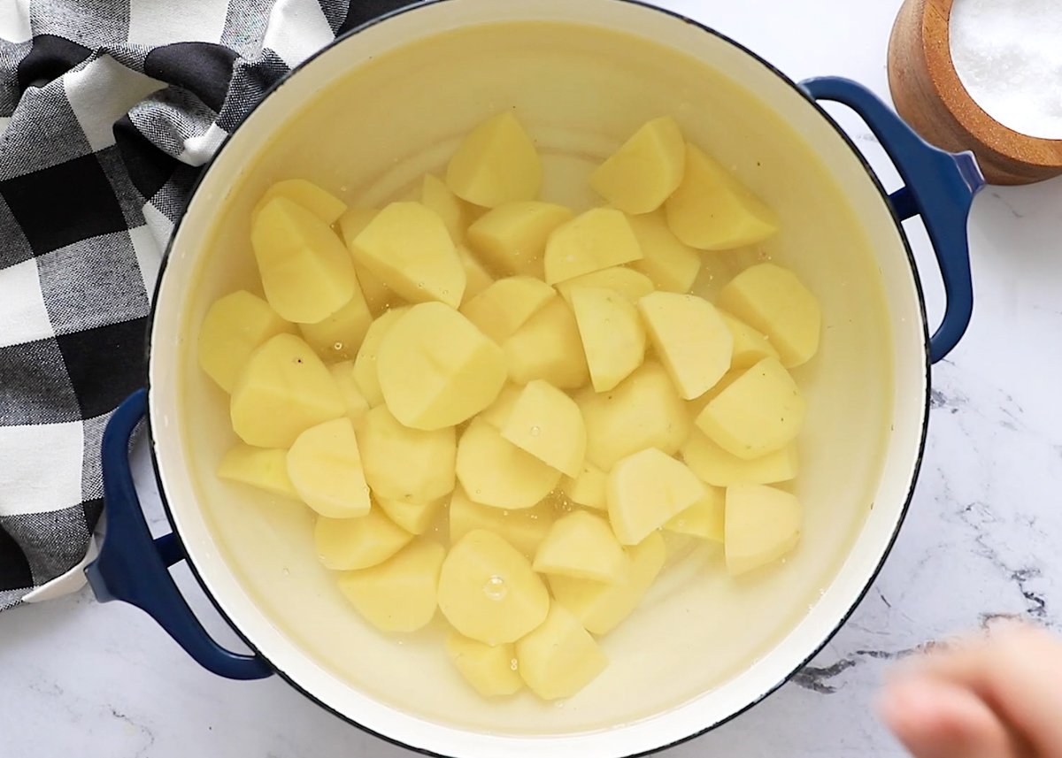 potatoes in a pot with water to make vegan mashed potatoes