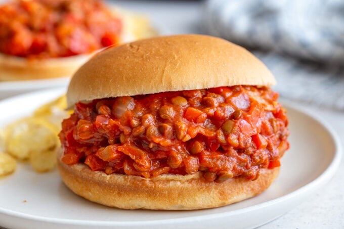 lentil sloppy joes on a bun with another in the background