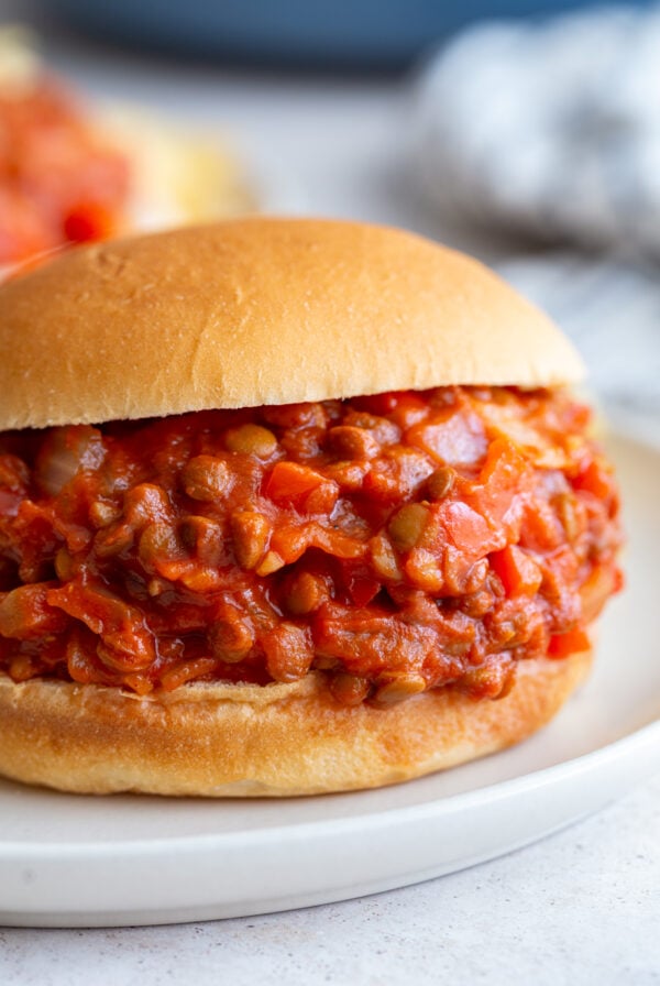 lentil sloppy joes on a bun with another in the background