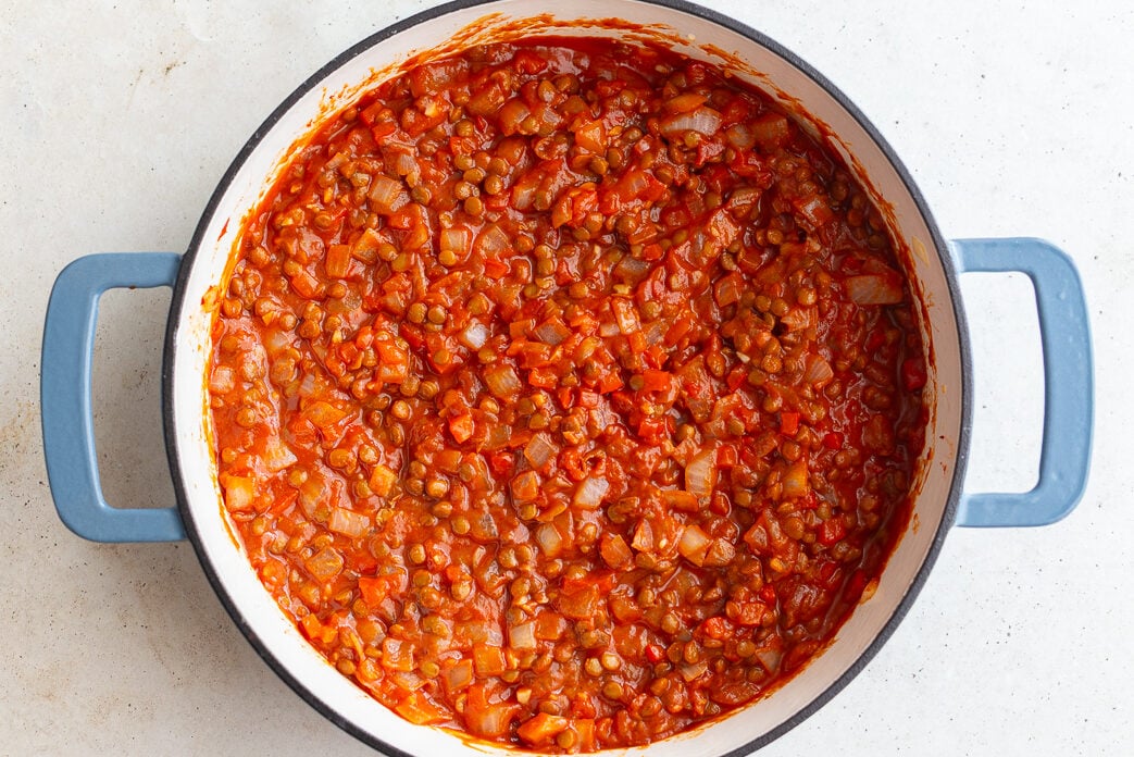 how to make vegan sloppy joes: lentils cooked with tomato paste and onion