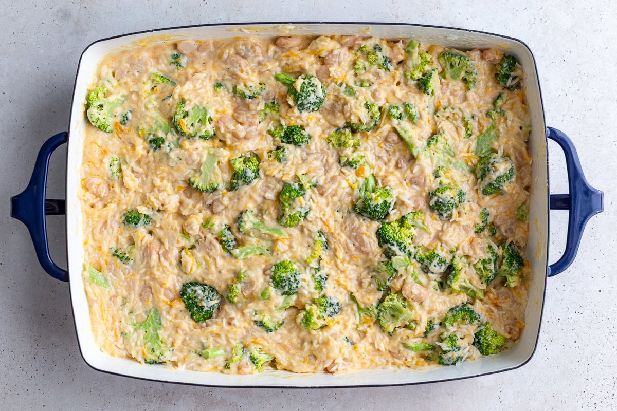 how to make cheesy broccoli rice casserole make the sauce and pour it over the rice, broccoli and beans