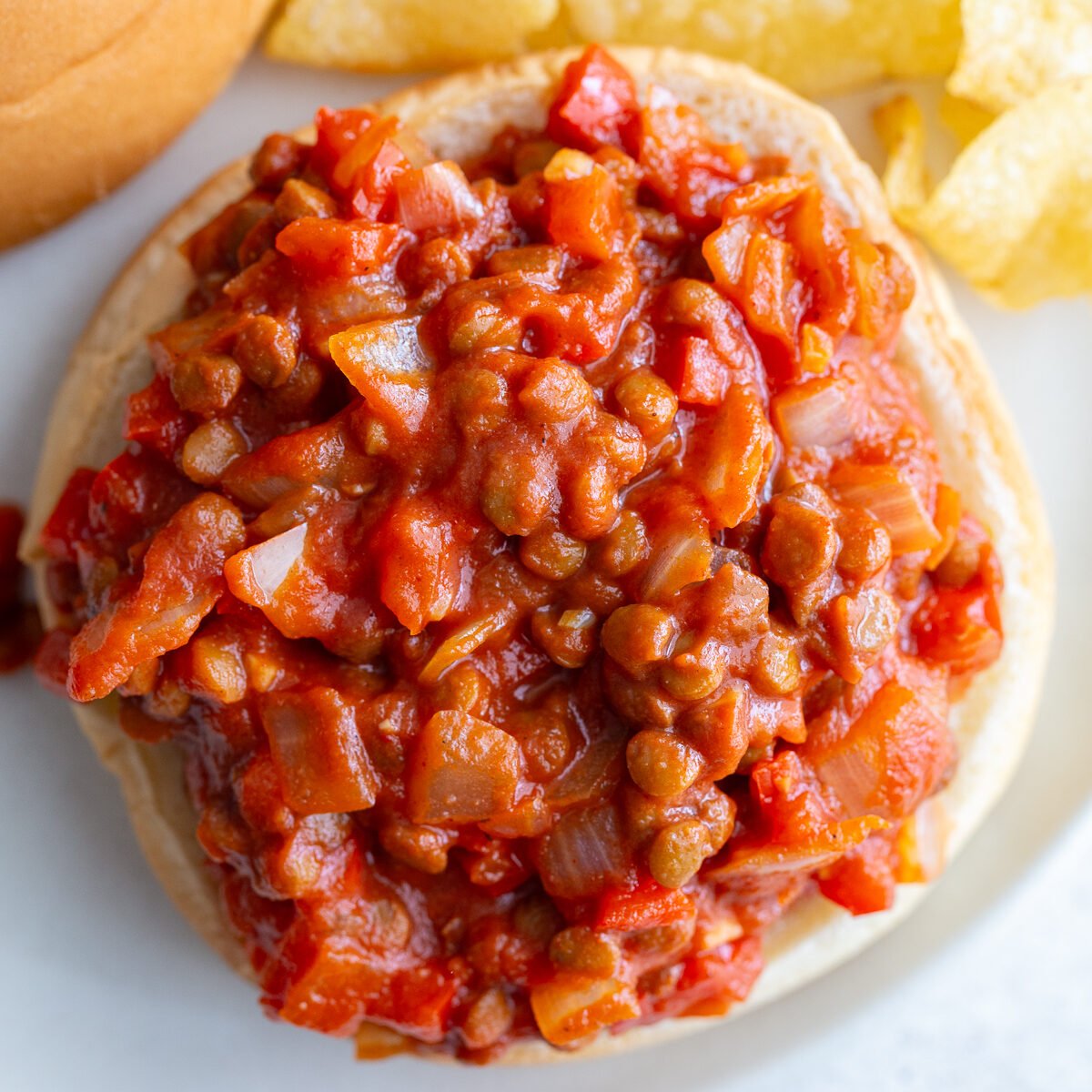 lentil sloppy joes on a bun with another in the background