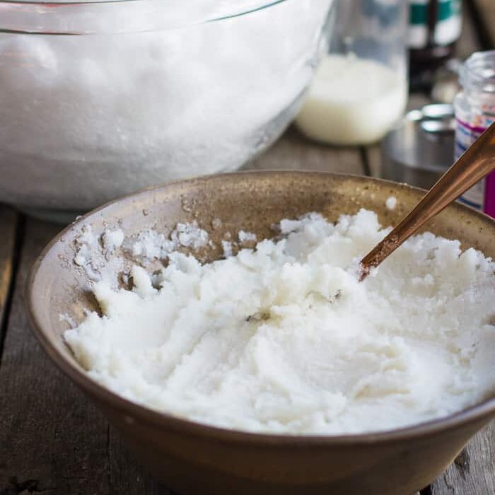 snow cream in a large bowl with snow in a large bowl behind it