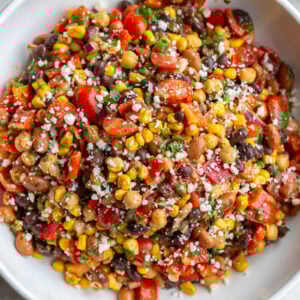 large bowl of Southwest bean salad filled with 3 types of beans and lots of veggies