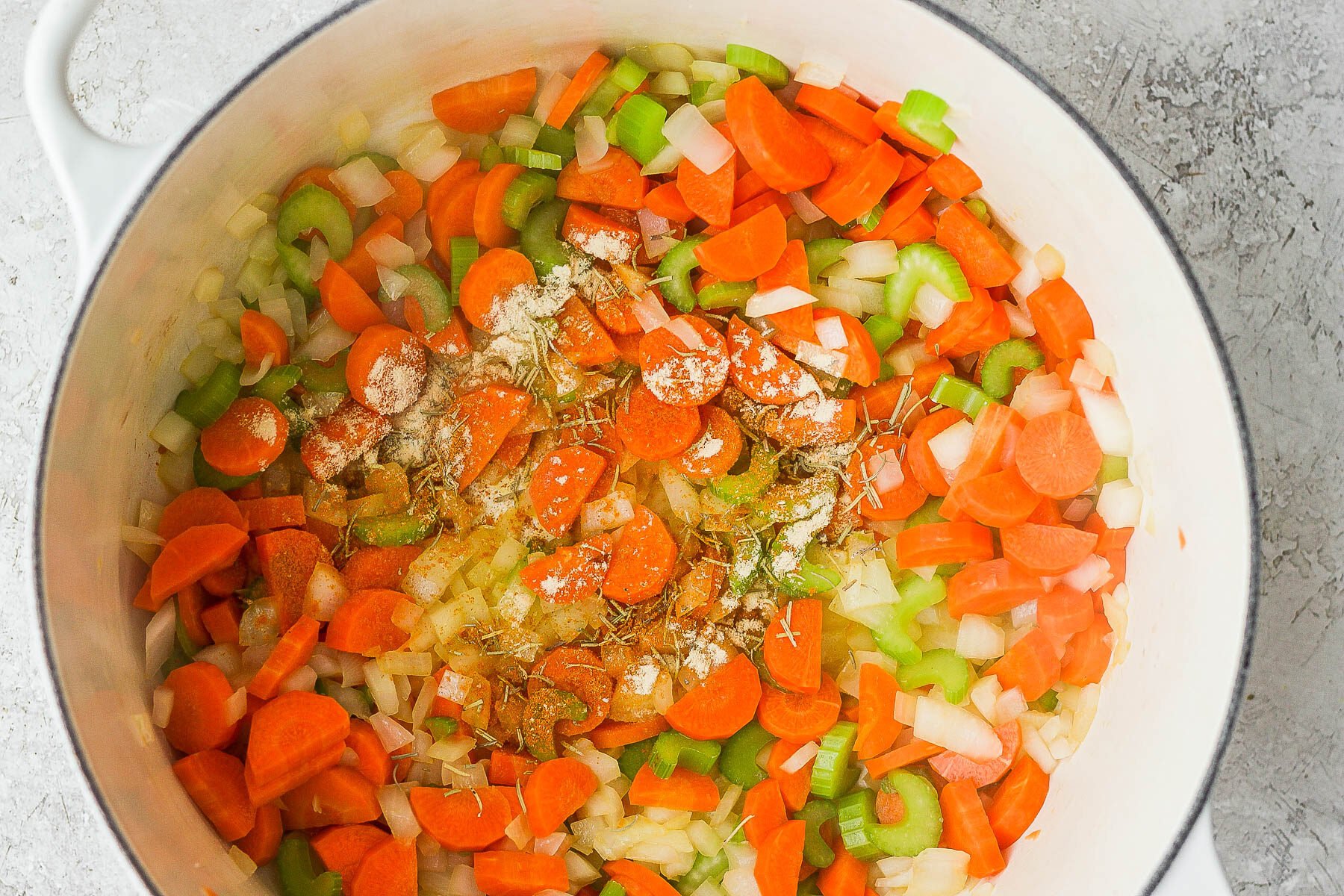 Saut&eacute;ing veggies in a large pot.