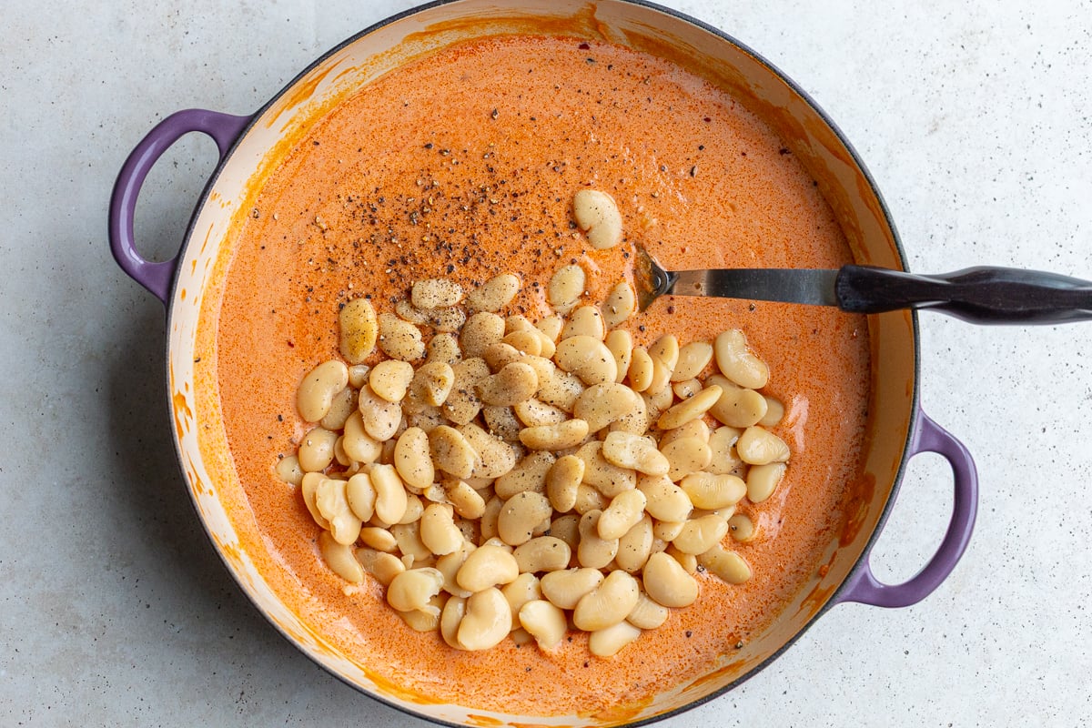 how to make creamy butter beans - the tomato creamy sauce with butter beans poured on top