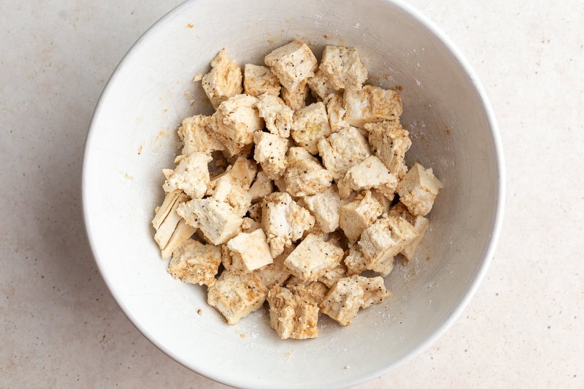 tofu chunks in a large white bowl