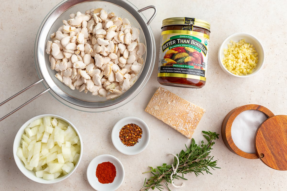 ingredients laid our that are needed to make lemon brothy beans