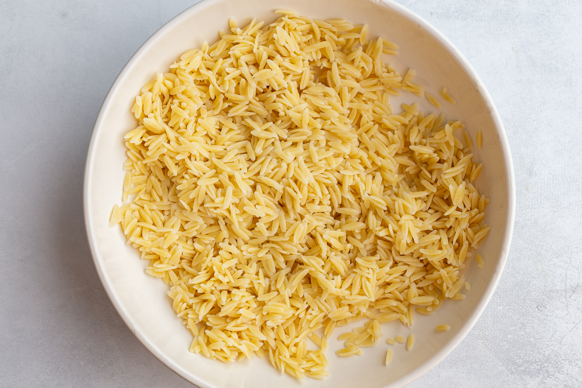 cooked orzo in a white bowl
