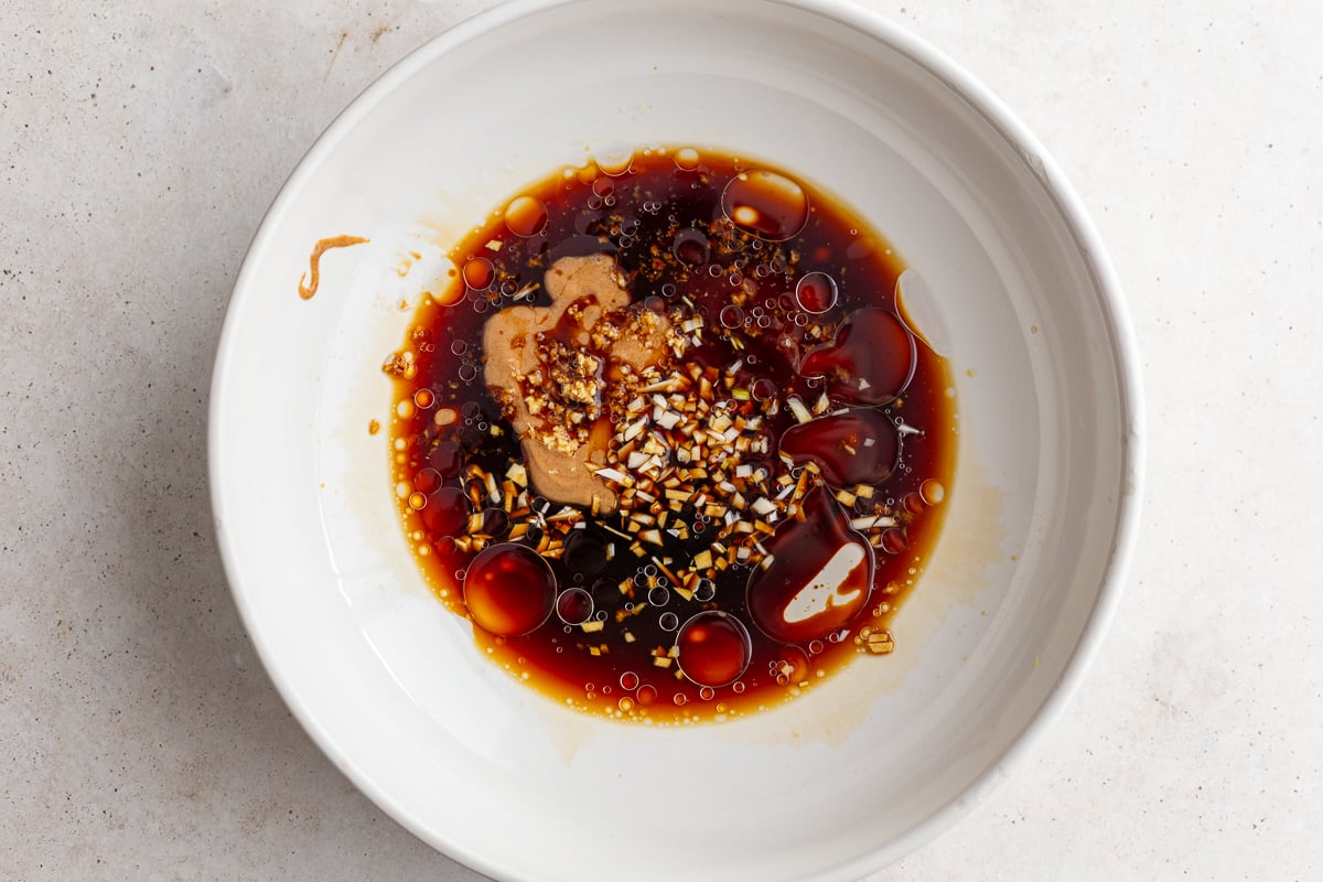 peanut sauce ingredients in a large bowl before being stirred together