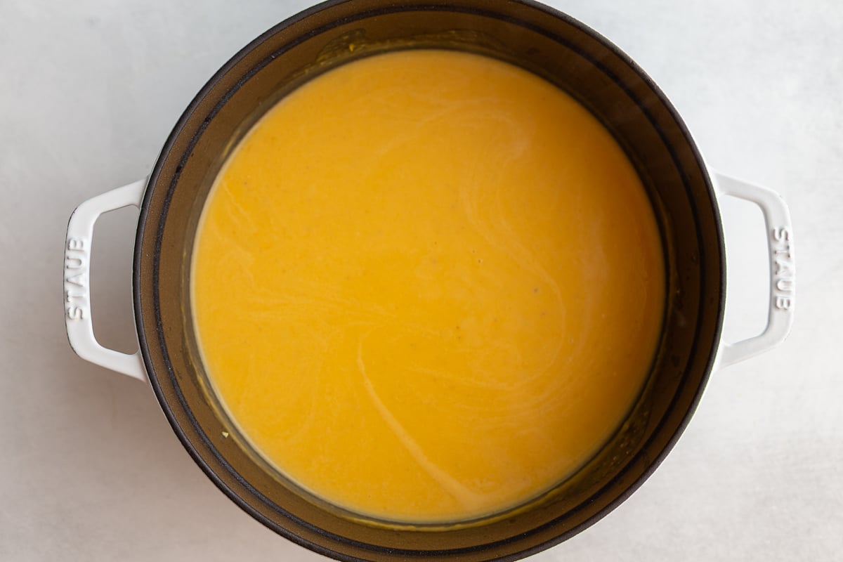 Creamy Roasted Butternut Squash Soup in a large cast iron pot