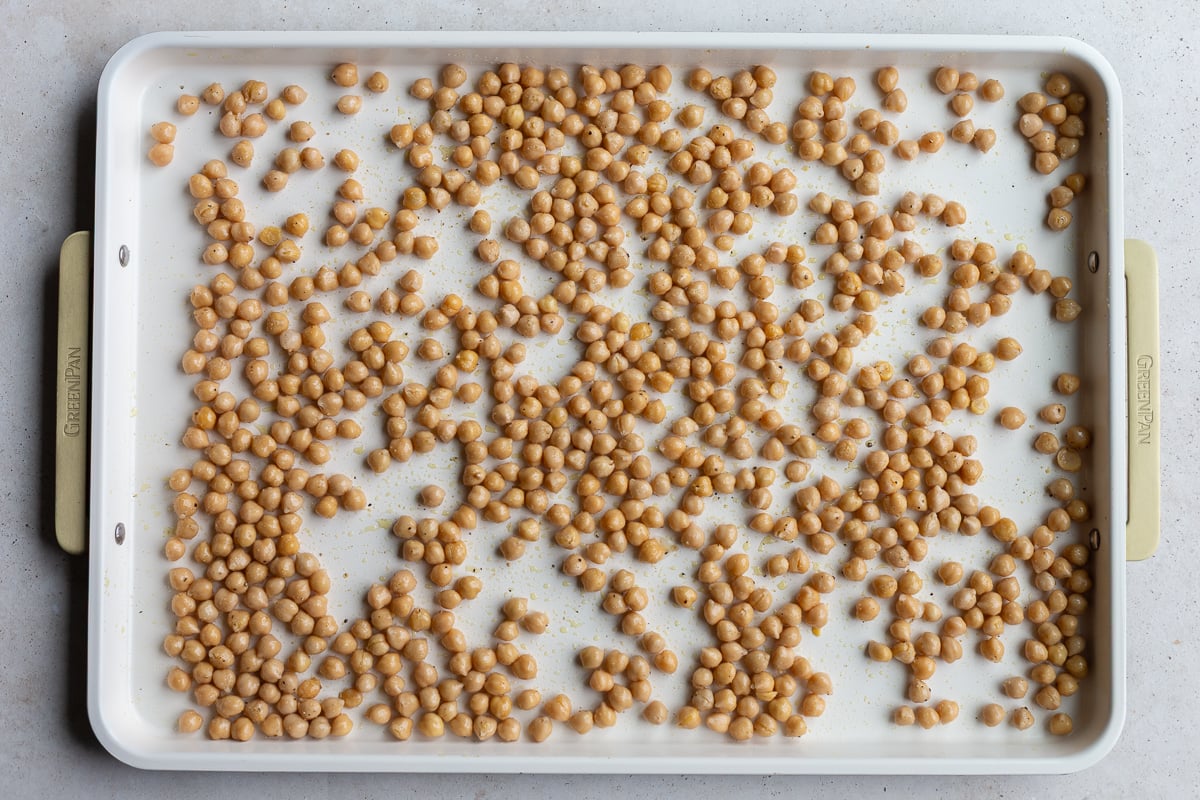 chickpeas on a baking tray to be roasted