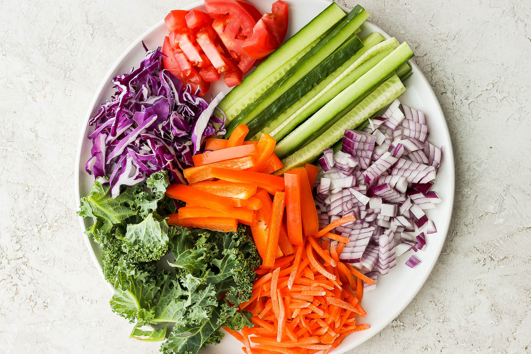 fresh veggies cut and sitting on a large plate