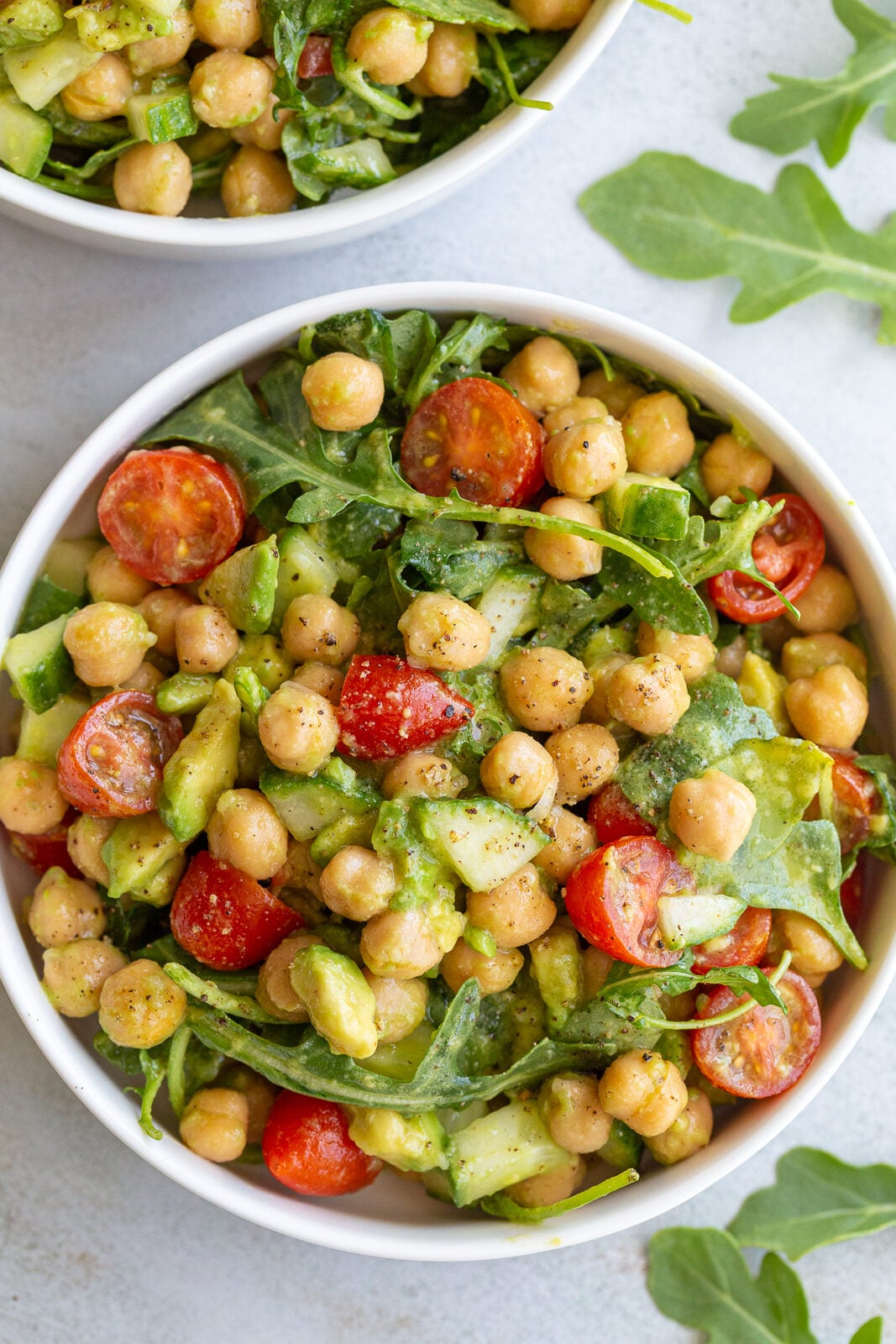 chickpea avocado salad with cherry tomatoes and arugula