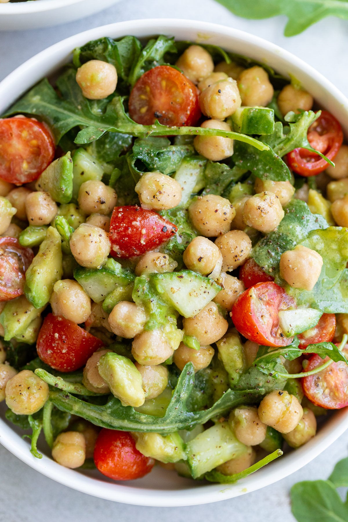 chickpea avocado salad with cherry tomatoes and arugula