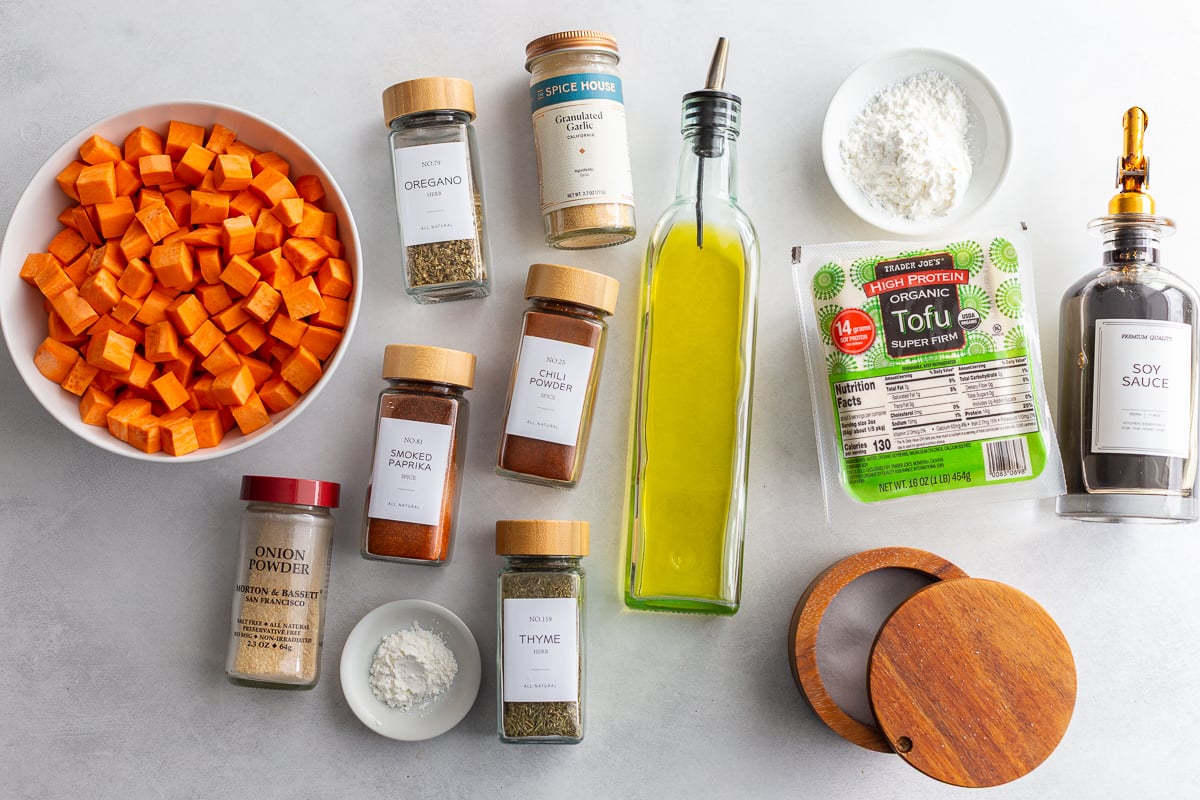 ingredients needed to make hot honey tofu bowls including tofu, hot honey, olive oil, spices, and sweet potato