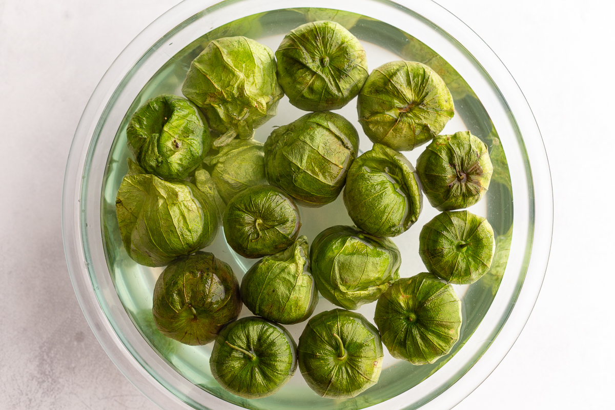 tomatillos in a bowl of water
