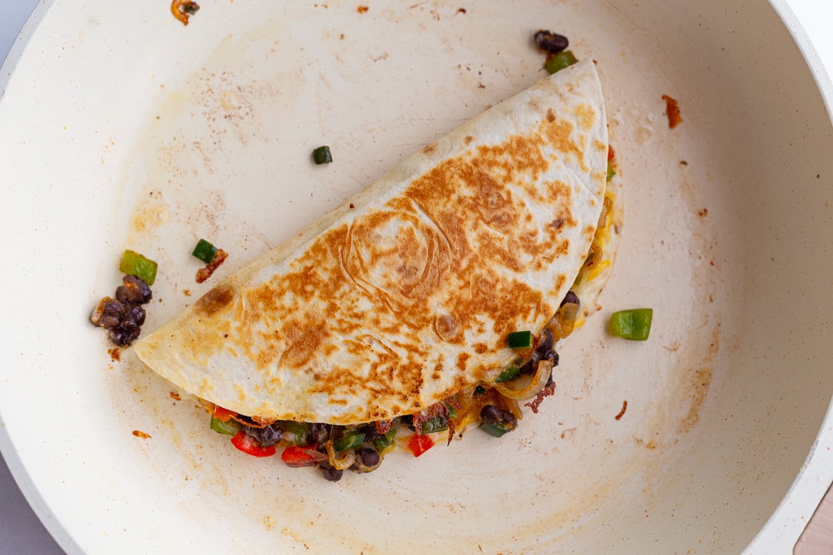 cooked meatless quesadilla in a large white skillet