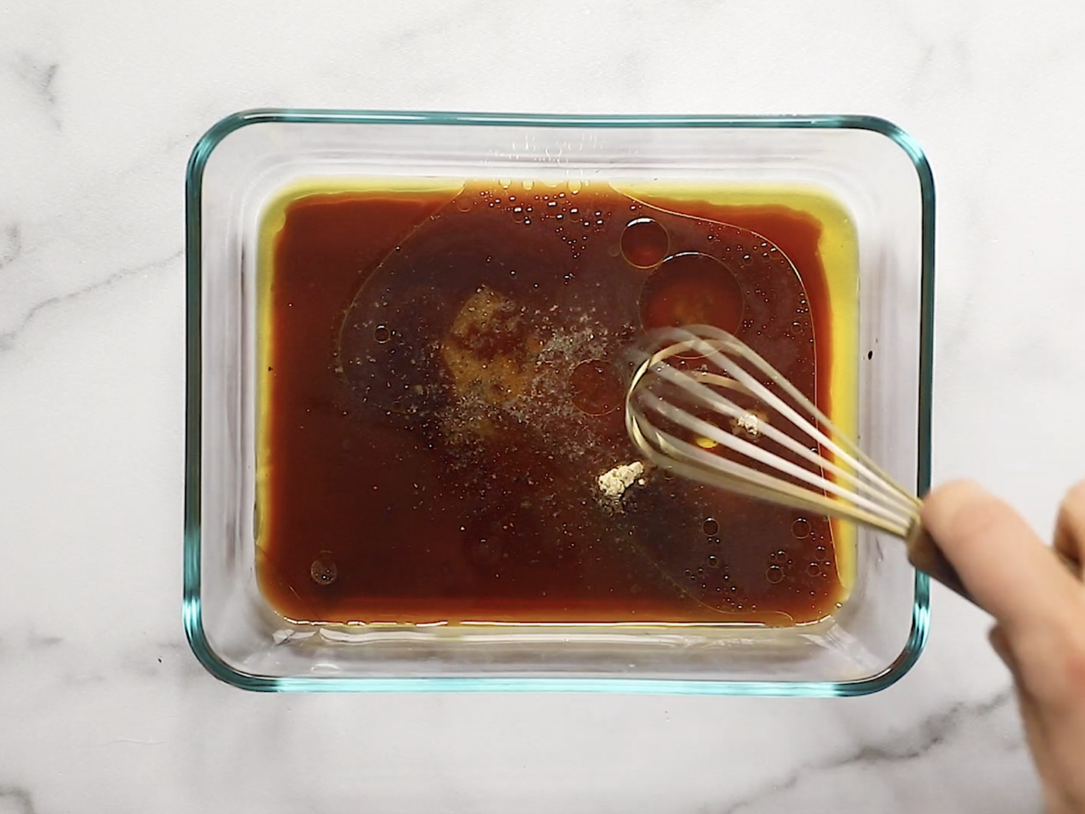grilled tofu marinade in a glass container