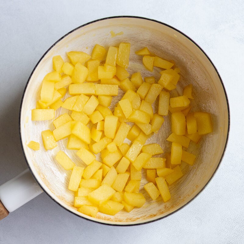 diced apples in a white pot