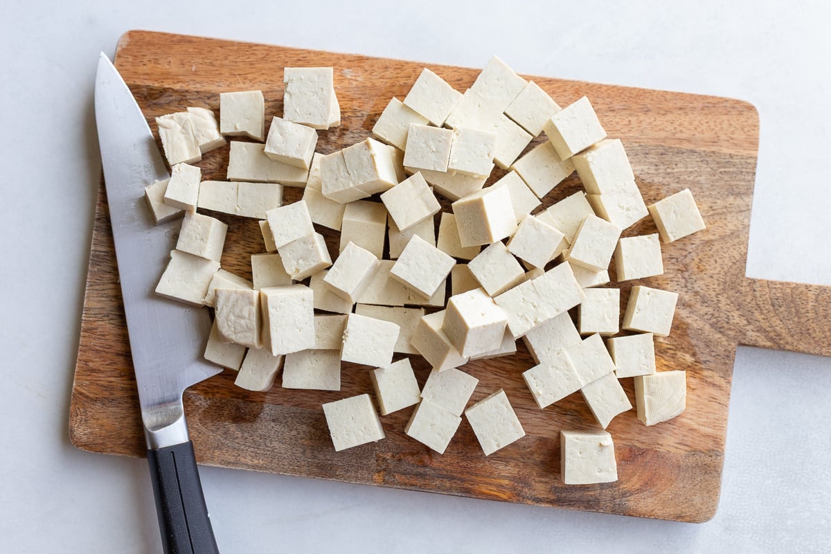 tofu cubes on a cutting board