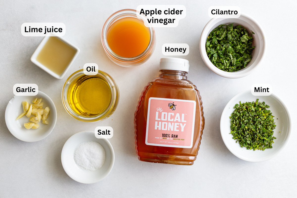 ingredients needed to make a cilantro lime dressing including honey, cilantro, olive oil, salt, etc