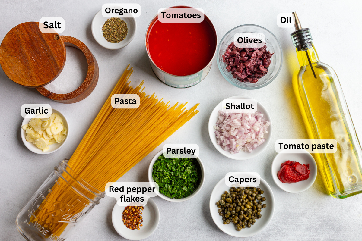 ingredients needed for pasta alla puttanesca including spaghetti, olie oil, capers, salt, herbs, shallot, etc