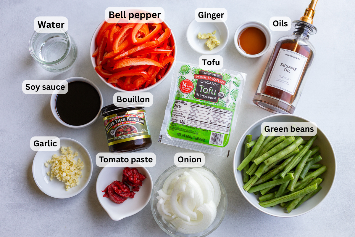 ingredients needed to make a ground tofu stir fry including tofu, bell pepper, green beans, oil, garlic, ginger, etc