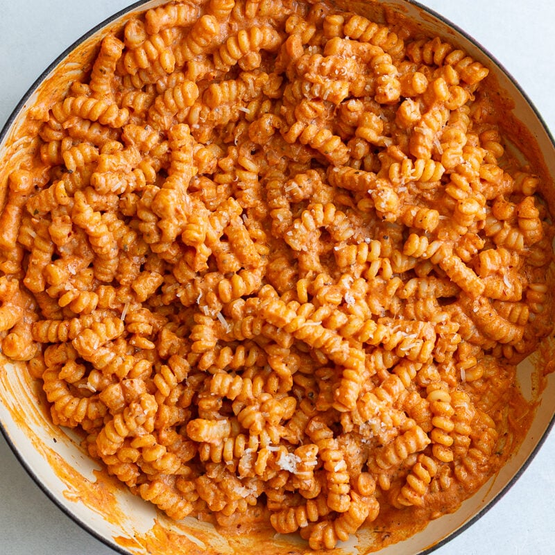 creamy tomato protein pasta in a large skillet