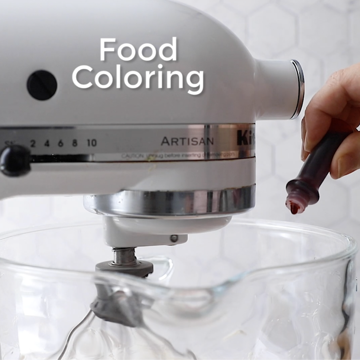 food coloring being added to the base of a food processor