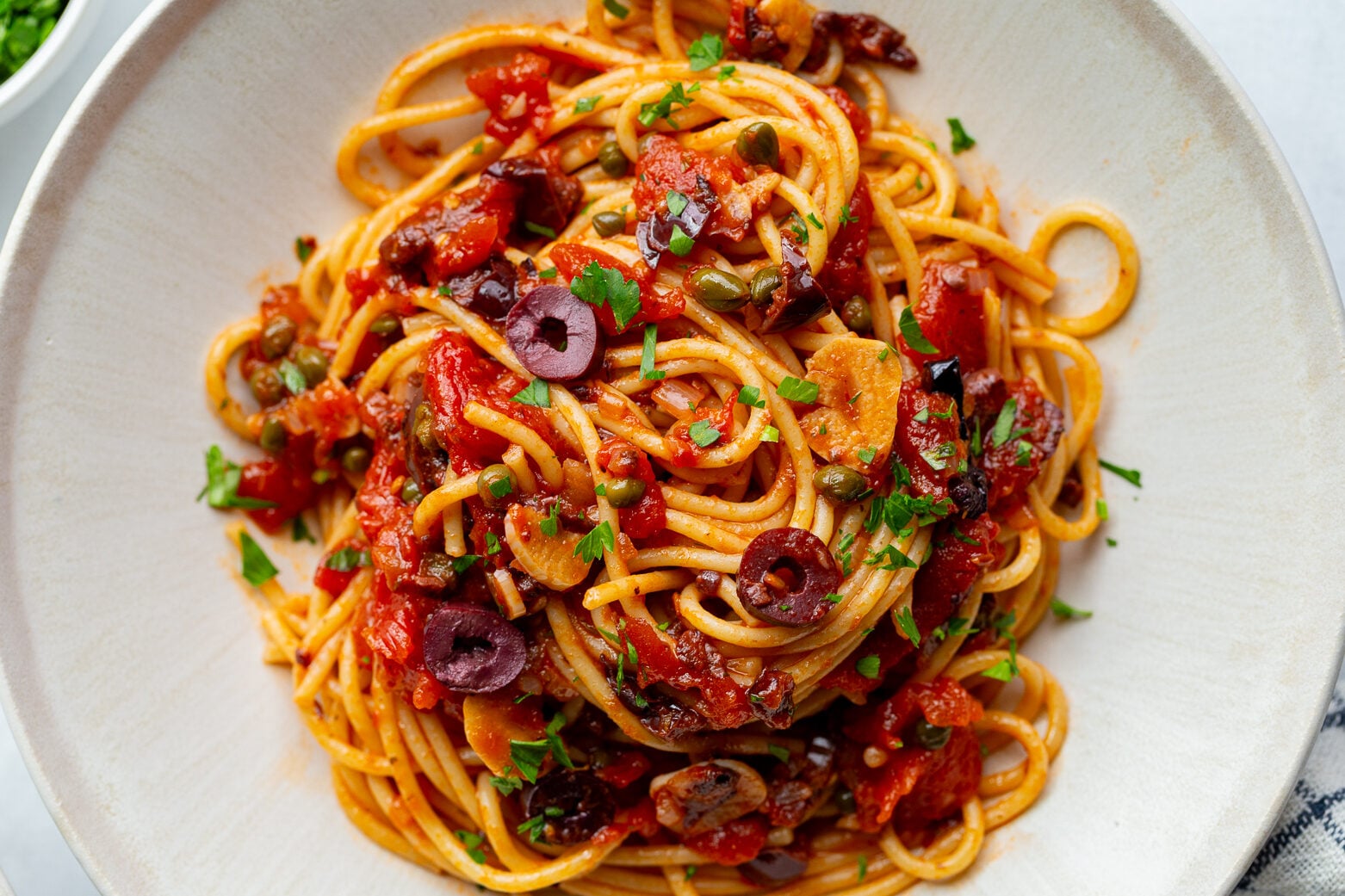 pasta alla puttanesca on a large plate