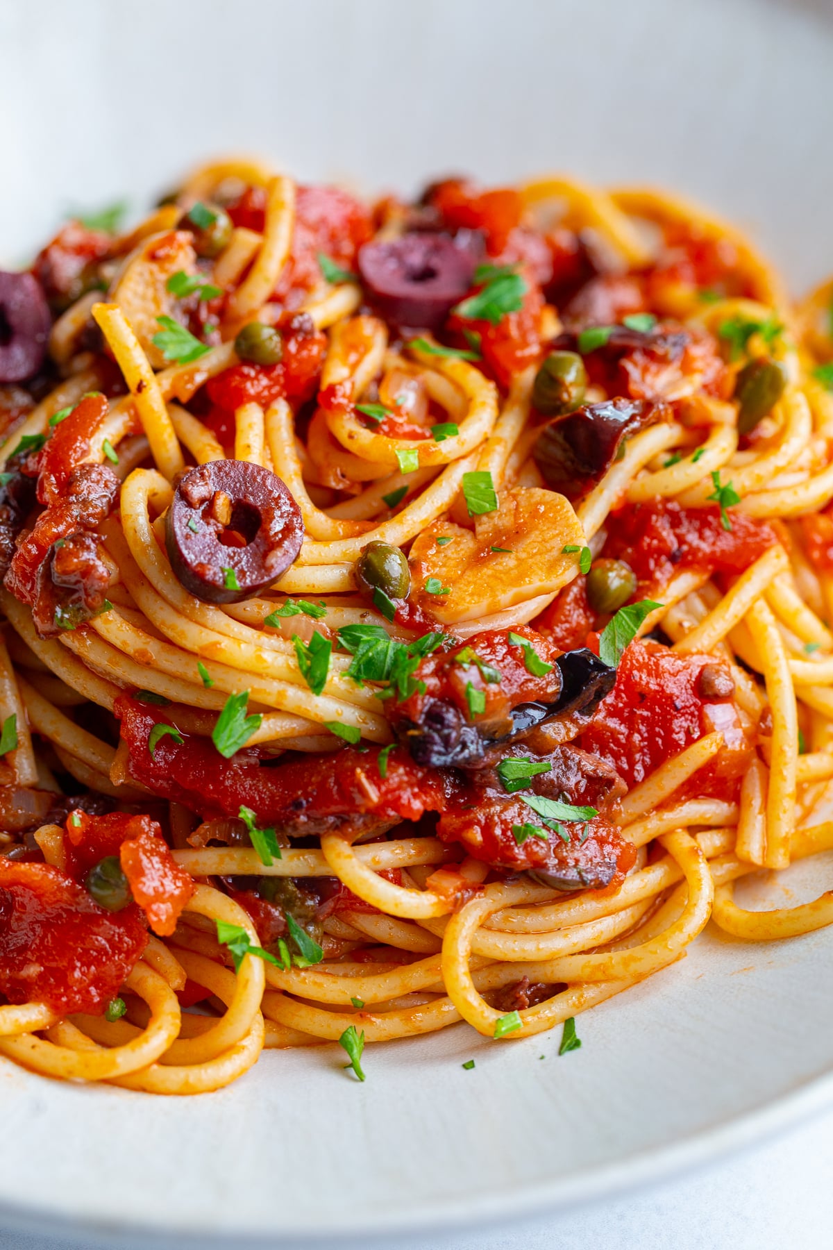 pasta alla puttanesca on a large plate