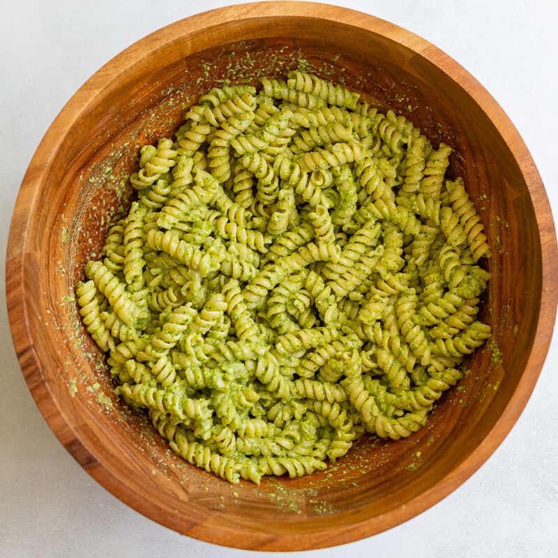 pesto pasta in a large wood bowl
